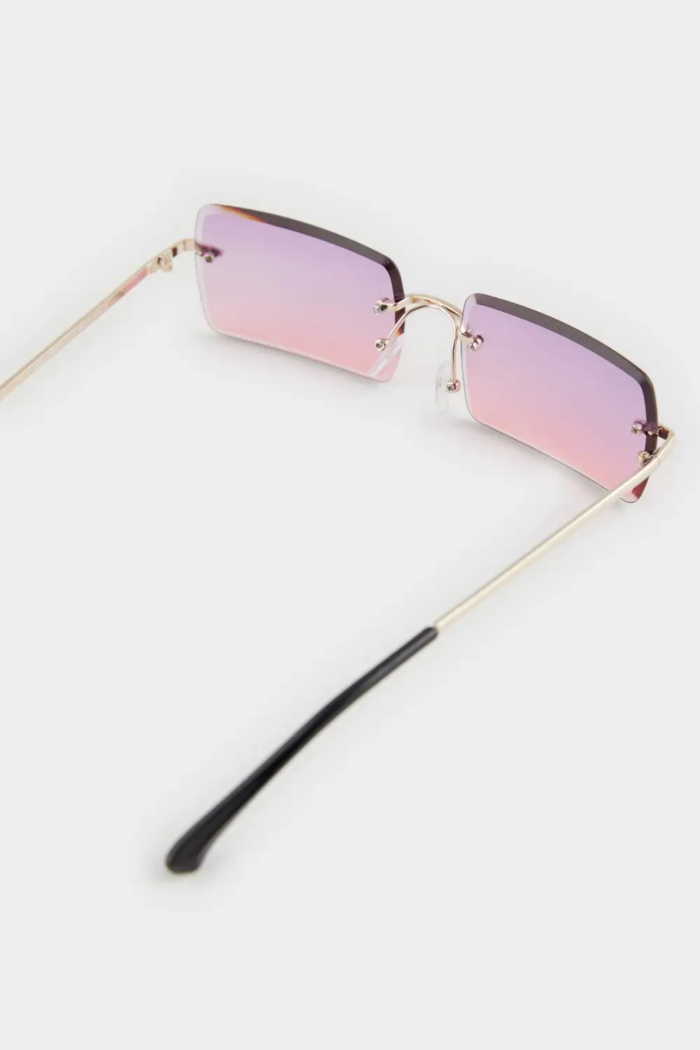 Pink-Lensed Metal Rimless Glasses